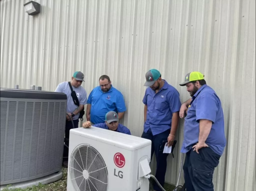 Texas Ace's HVAC professionals working on an LG HVAC system.